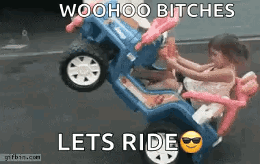 Two Little Girls Are Riding In A Toy Jeep On A Road . GIF