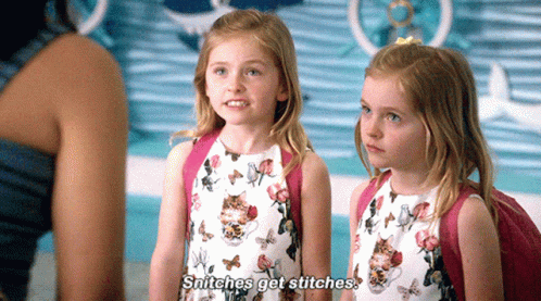 Two Little Girls Are Standing Next To Each Other And One Says Snitches Get Stitches GIF