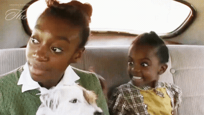 Two Little Girls in Back Seat With Dog