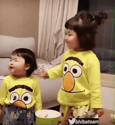 Two Little Girls In Sesame Street Shirts GIF