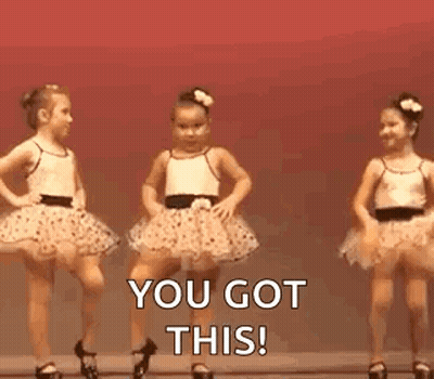 Two Little Girls In Tutus Are Dancing On A Stage . GIF