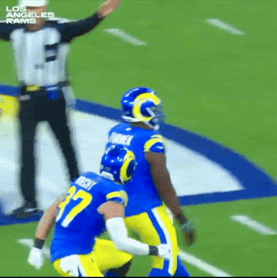 Two Los Angeles Rams Players With Referee GIF