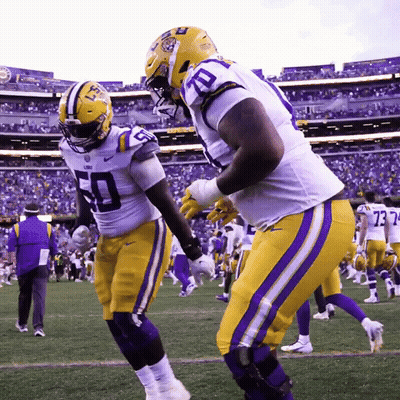 Two LSU Football Players Number 50 And 73 GIF