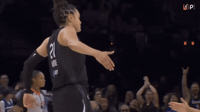 Two Lynx Basketball Players Are Hugging Each Other During A Game GIF