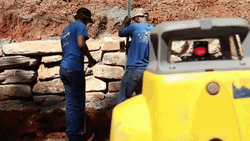 Two Man In Blue Shirts Surveying Around GIF
