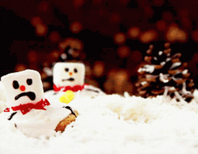 Two Marshmallow Snowmen With Sad Faces Are In The Snow GIF