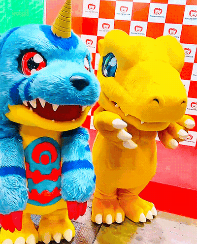 Two Mascots Are Standing Next To Each Other And One Has A Horn GIF