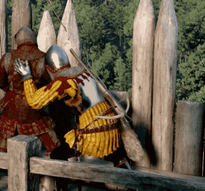 Two Medieval Soldiers Standing By Wooden Fence GIF