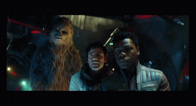 Two Men And A Chewbacca Are Standing In A Dark Room GIF