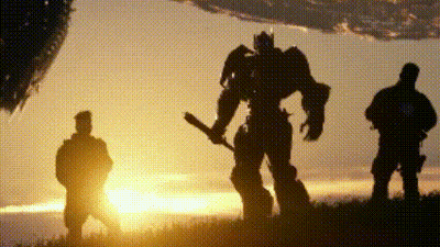 Two Men And A Robot Holding A Bat At Sunset GIF
