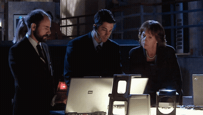 Two Men And Woman Looking At ThinkPad Laptop GIF