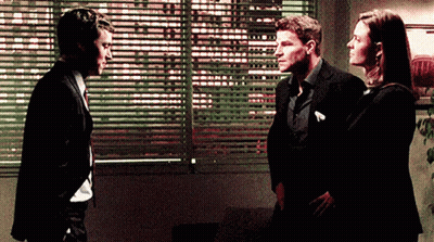 Two Men And Woman Standing In Front Of Window GIF