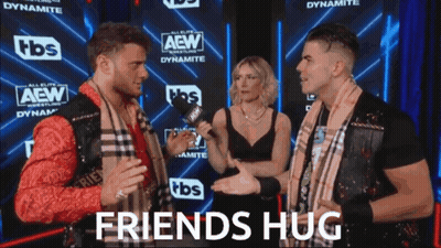 Two Men And Woman Talking Near Friends Hug Sign GIF