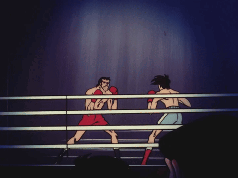 Two Men Are Boxing In A Ring And One Is Wearing Red Gloves GIF