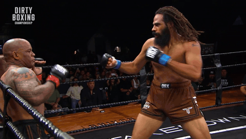 Two Men Are Boxing In A Ring With The Words Dirty Boxing Championship On The Bottom GIF