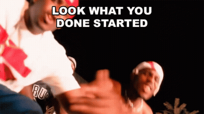 Two Men Are Dancing And The Words Look What You Done Started Are Visible GIF