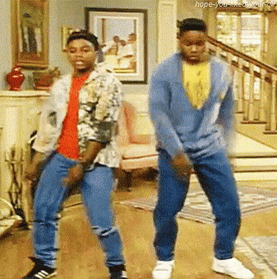 Two Men Are Dancing In A Living Room With The Words Hope-You-Like-You-Gif Below Them GIF