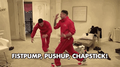 Two Men Are Dancing In A Room With The Words Fistpump Push Up Chapstick GIF