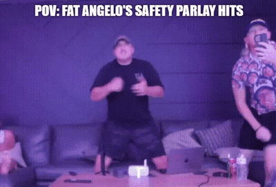 Two Men Are Dancing In Front Of A Purple Wall With The Words POV Fat Angelo 'S Safety Parlay Hits GIF