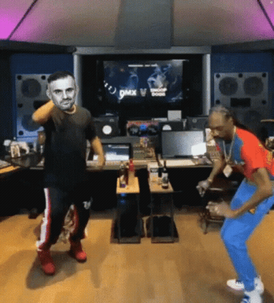 Two Men Are Dancing In Front Of A Screen That Says Dmx On It . GIF