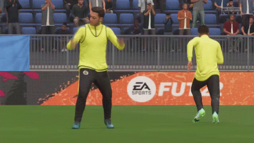 Two Men Dancing On Soccer Field In Front Of EA Sports Logo GIF