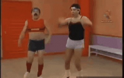 Two Men Are Doing Exercises In A Gym . GIF