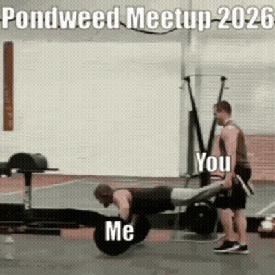 Two Men Are Doing Push Ups In A Gym And One Of Them Is Carrying Another Man On His Back . GIF