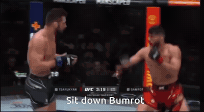 Two Men Are Fighting In A Boxing Match And One Of Them Says Sit Down Bumrot On The Screen GIF
