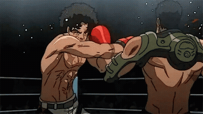 Two Men Are Fighting In A Boxing Ring And One Has A Green Arm Guard GIF