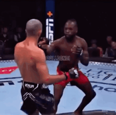 Two Men Are Fighting In A Boxing Ring And One Has The Word Venum On His Shorts GIF