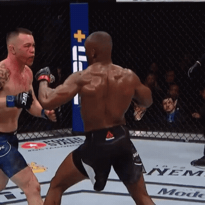 Two Men Are Fighting In A Boxing Ring And One Of Them Has Reebok Shorts On GIF
