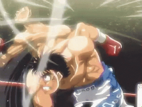 Two Men Are Fighting In A Boxing Ring And One Of Them Is Wearing A Pair Of Shorts With The Letter L On Them . GIF