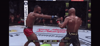 Two Men Are Fighting In A Boxing Ring And One Of Them Is Wearing A Venum Outfit GIF