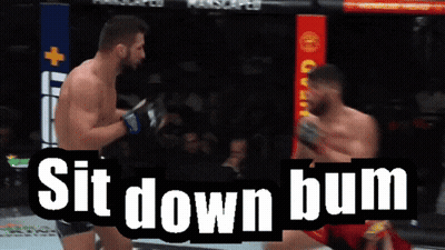 Two Men Are Fighting In A Boxing Ring And The Words Sit Down Bum Are Above Them GIF