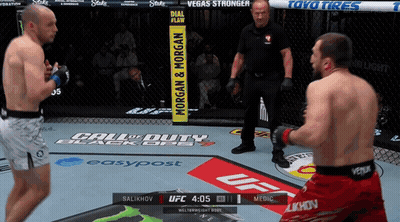 Two Men Are Fighting In A Boxing Ring Sponsored By Call Of Duty And Toyo Tires GIF
