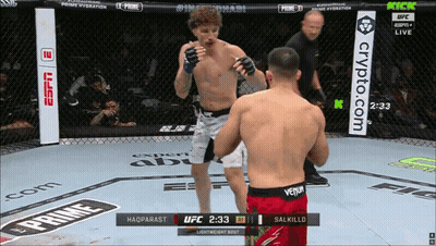 Two Men Are Fighting In A Boxing Ring With A Banner For Crypto.com GIF