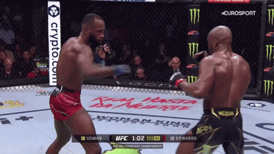 Two Men Are Fighting In A Boxing Ring With A Crypto.com Advertisement In The Background GIF