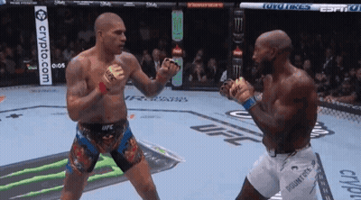 Two Men Are Fighting In A Boxing Ring With A Crypto.com Banner In The Background GIF