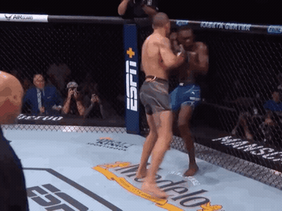 Two Men Are Fighting In A Boxing Ring With A Espn Logo In The Background GIF