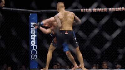 Two Men Are Fighting In A Boxing Ring With A Metropcs Banner On The Side GIF