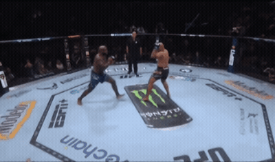 Two Men Are Fighting In A Boxing Ring With A Monster Energy Drink Advertisement On The Floor GIF