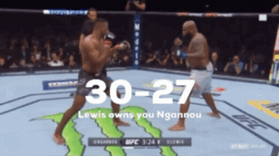 Two Men Are Fighting In A Boxing Ring With A Monster Energy Logo On The Ground GIF
