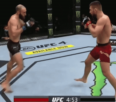 Two Men Are Fighting In A Boxing Ring With A Monster Energy Sign In The Background GIF