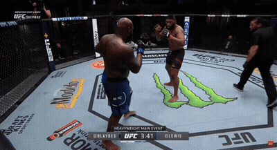 Two Men Are Fighting In A Boxing Ring With A Monster Logo On The Floor GIF