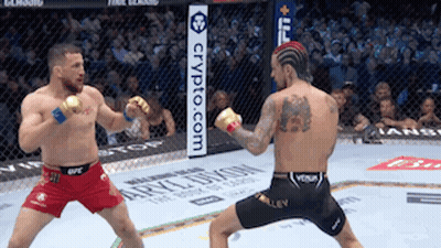 Two Men Are Fighting In A Boxing Ring With A Sign That Says Crypto.com In The Background . GIF
