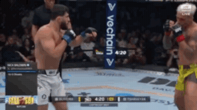 Two Men Are Fighting In A Boxing Ring With A Sign That Says Vechain On It GIF
