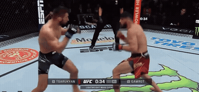 Two Men Are Fighting In A Boxing Ring With Advertisements For Toyo Tires On The Wall GIF