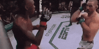 Two Men Are Fighting In A Boxing Ring With Espn Written On The Floor GIF