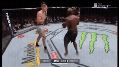 Two Men Are Fighting In A Boxing Ring With Monster On The Floor GIF