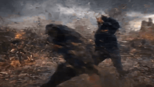 Two Men Are Fighting In A Field With A Lot Of Smoke Coming Out Of The Ground GIF